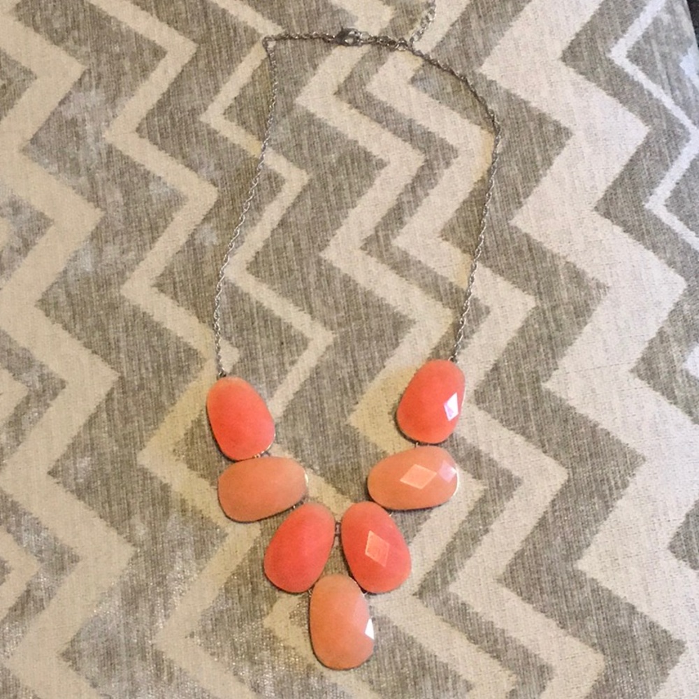 Peach toned necklace.